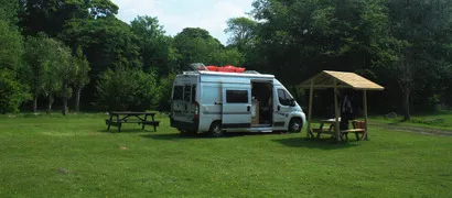 Motorhomewithkayakongrasspitchwide11